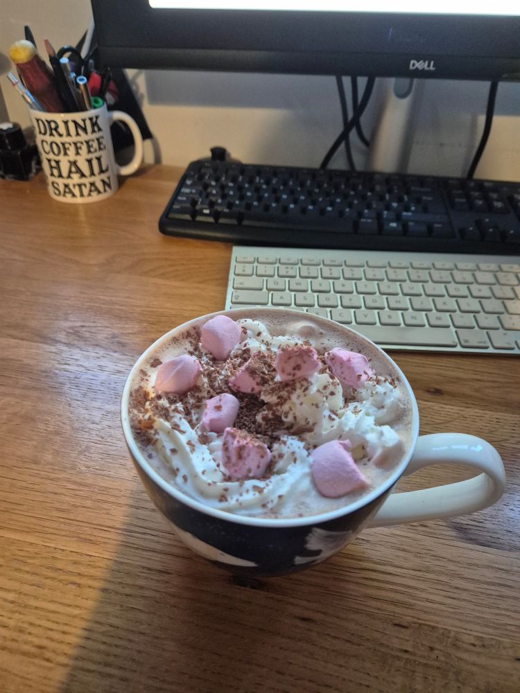 Hot chocolate with marshmallows and squirt cream 