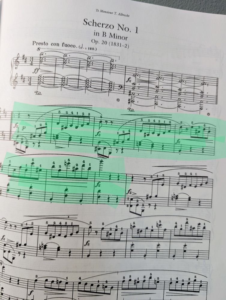 A page of piano sheet music. The piece is Chopin's Scherzo No. 1 in B Minor. Two lines are highlighted in green.