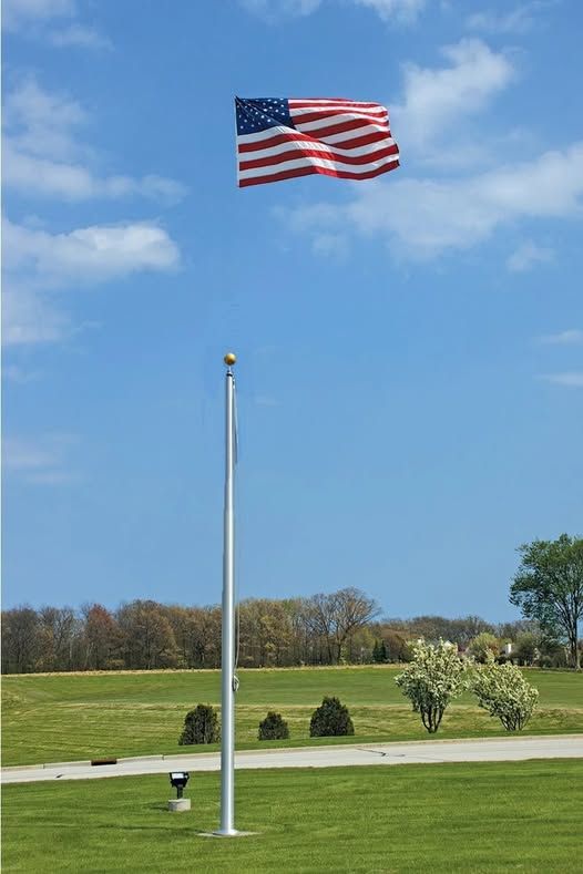 Flag floating well above the top of the flag pole.