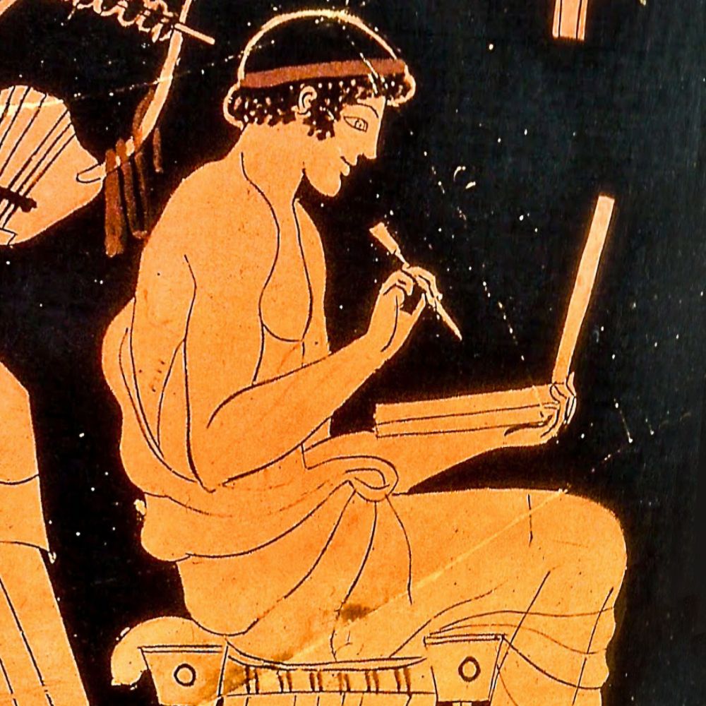 Vase painting of a man looking at what looks like a laptop and holding a stylus. 