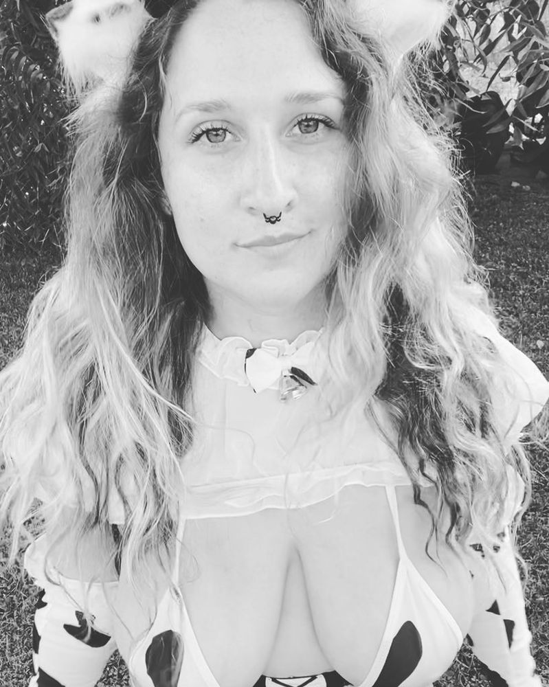 Annabel in a hucow outfit. The photo is in greyscale.