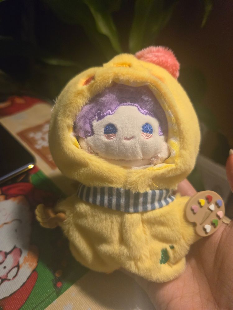 Hand sewed 3.5 inch (8.89) Rafayel mini doll wearing signature duck artist clothes. A paint brush is held in one hand, and a palette in the other. He bas a beret and a scarf. 