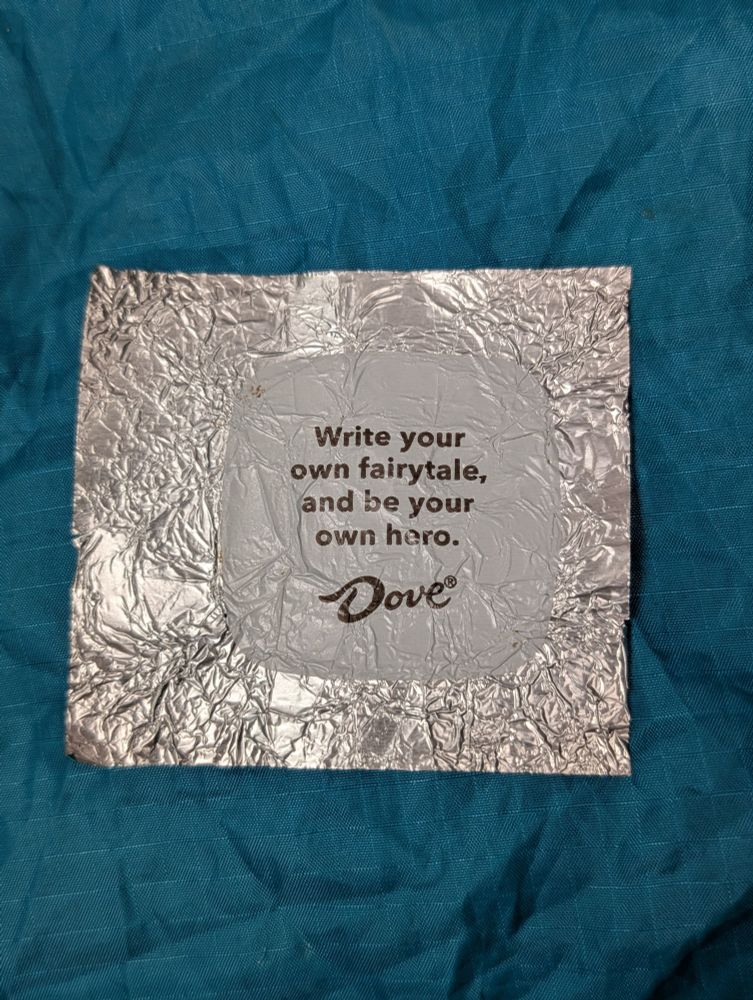 Dove Chocolate foil wrapper with the message - "Write your own fairytale, and be your own hero."