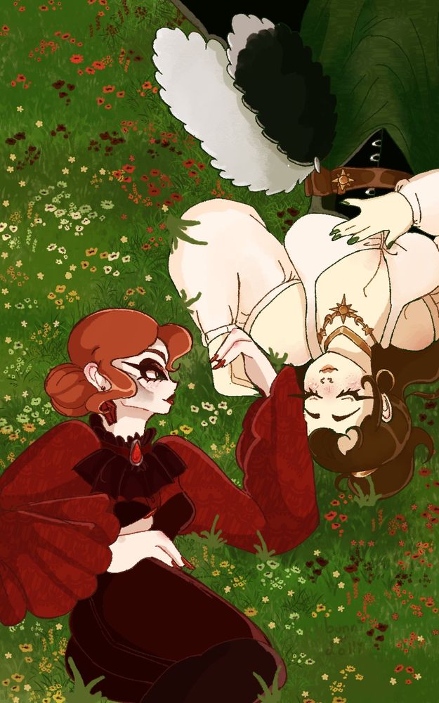 two women who are in love lay in flower fields of grass and holding hands