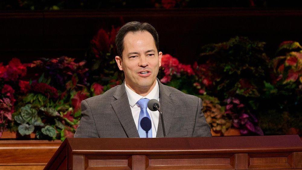 Elder Ronald M. Barcellos speaks from the pulpit in the Conference Center.