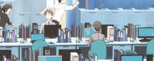 Anime.  A woman chasing a man around an office, attempting to smack him with a folder. 