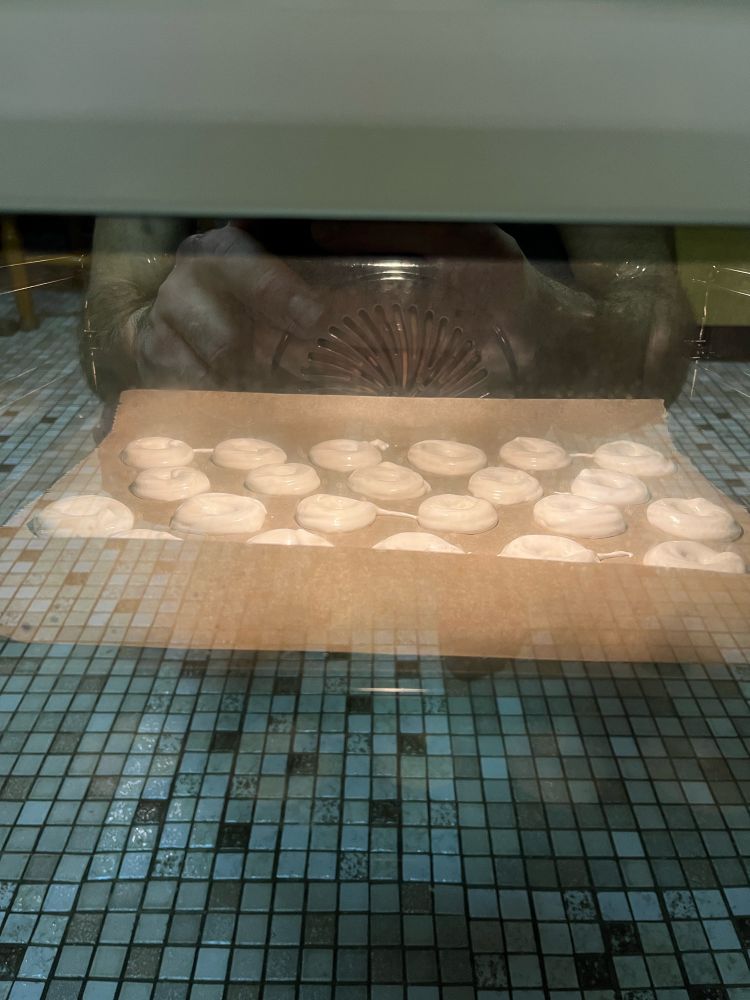 A tray baking cookies in the oven