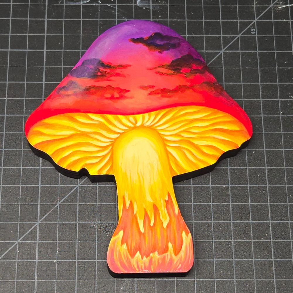A mushroom-shaped panel, painted to resemble an orange and purple sunset.