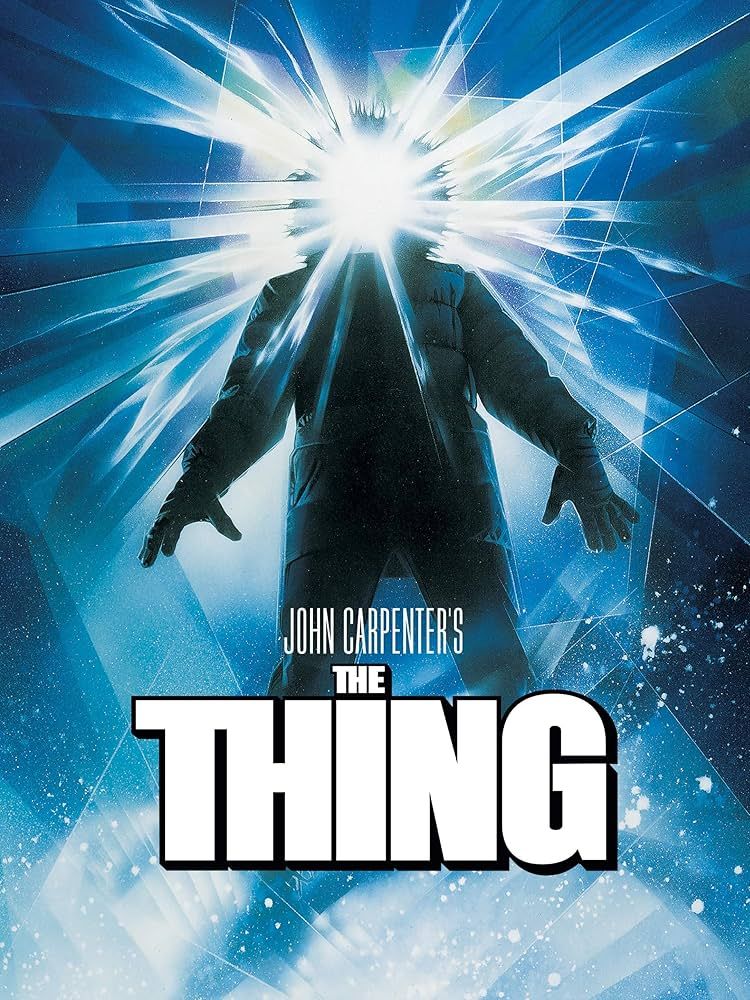 The iconic poster of The Thing, depicting a winter clad humanoid figure with an open parka with a shining light where their head should be