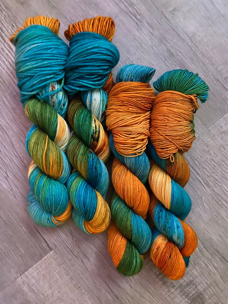 Four skeins of wound yarn I turquoise and orange