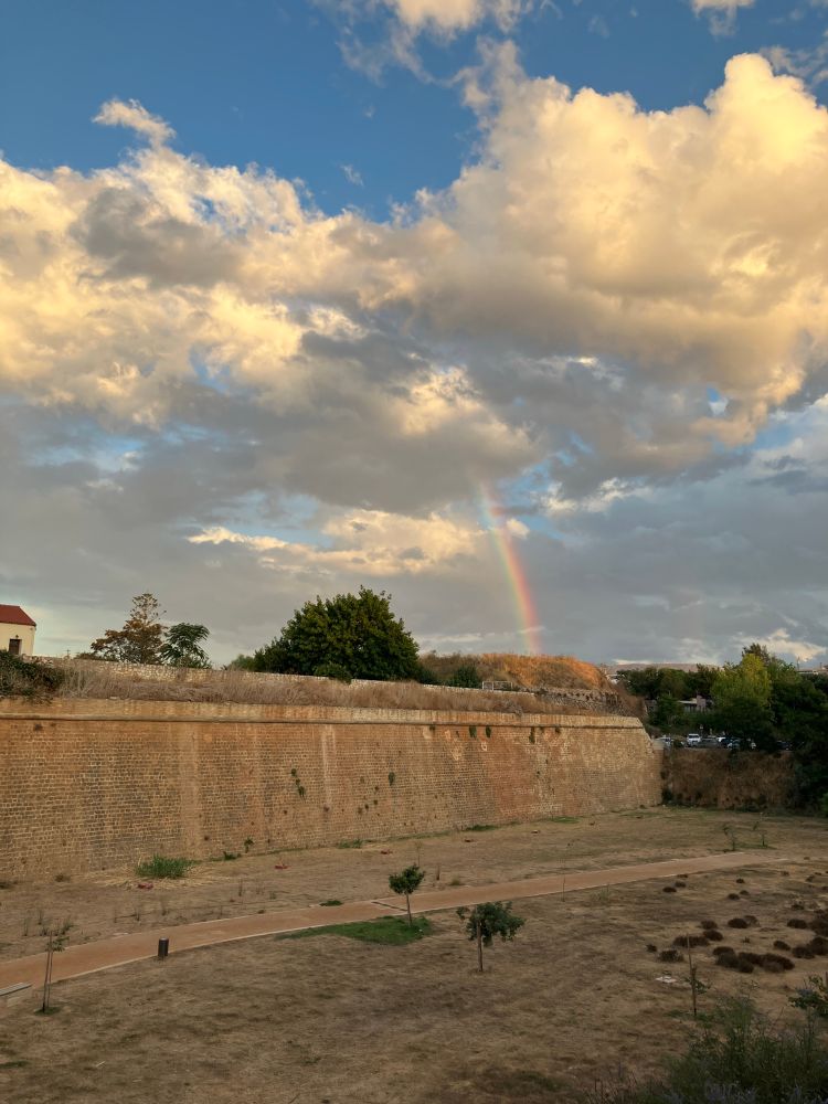 Rainbow over a Venetian wall and moat
