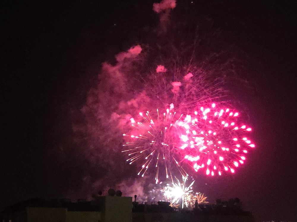 Two red bursts of fireworks 