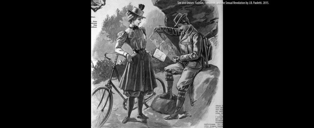 man and woman from some time in the past where the queen on the left has a waist trainer or corset with a long skirt and bloomer pants, puffy sleeves and a top hat leaning against a bike. the dude in the right is dressed like an explorer type with bloused pants and a double breasted coat with backpack. 