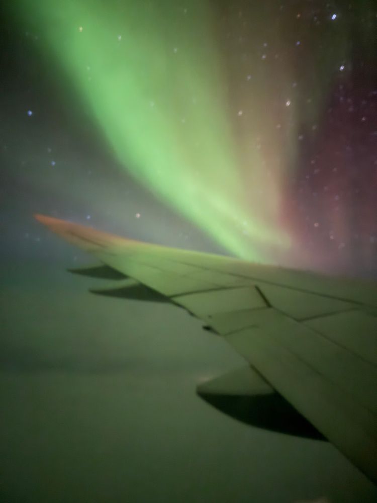 Northern Lights above the North Pole as seen from an airplane