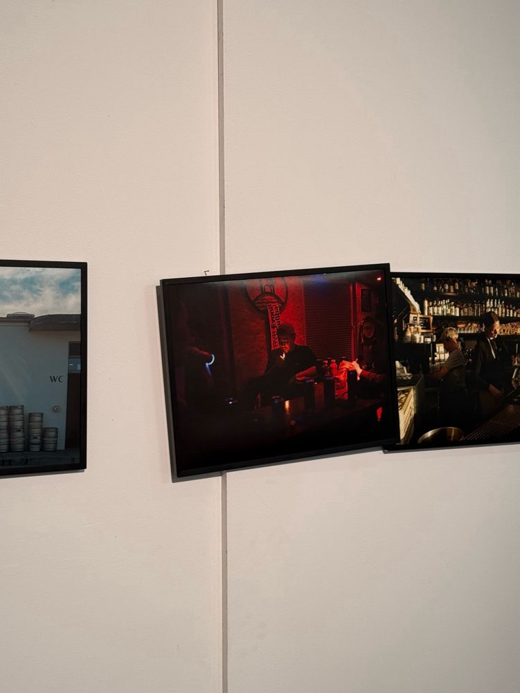 An image in an exhibition hanging loose on one nail