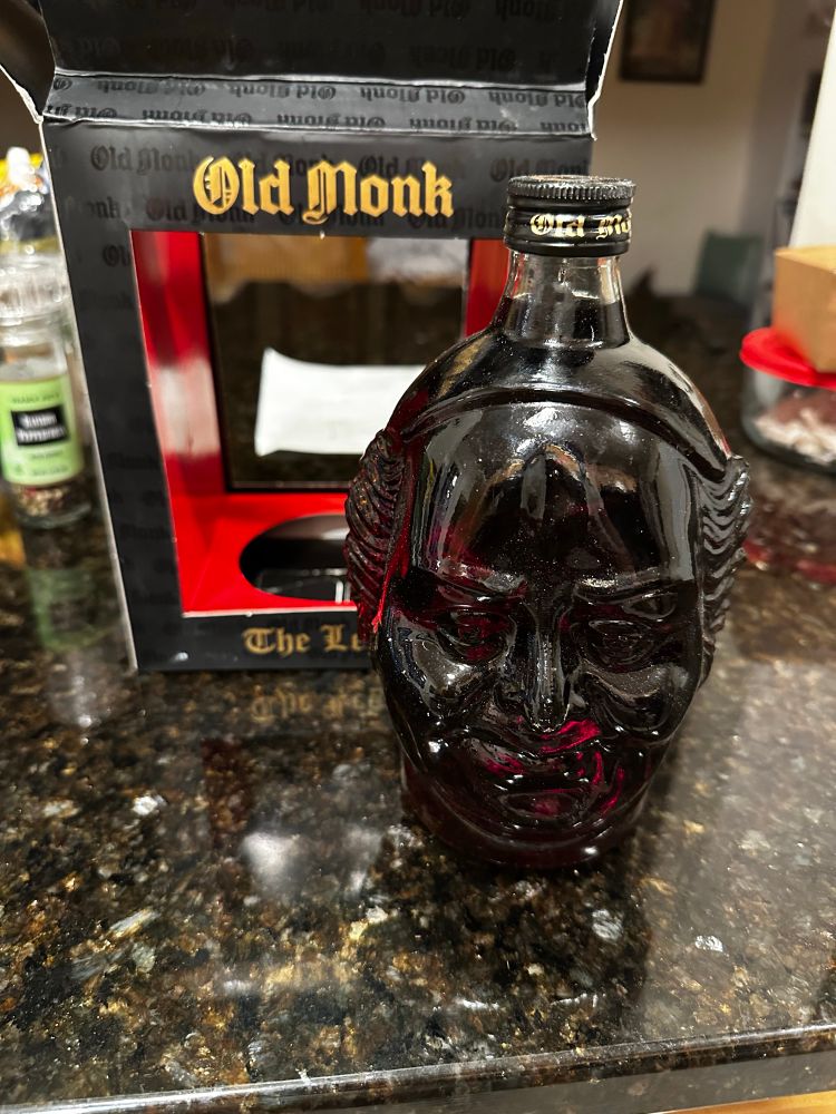 Bottle of “Old Monk” rum from India, which is in the shape of an old monk’s head 