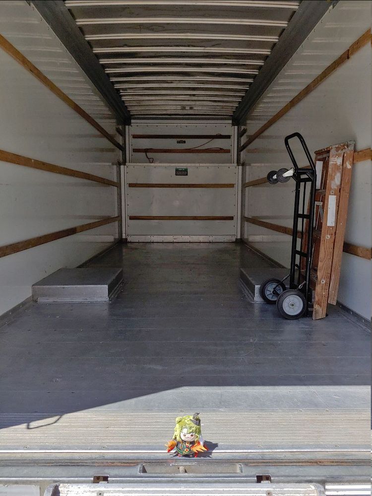 Girl_DM_ nui with empty uhaul truck except for dolly and ladder on the right and some rope in the back.