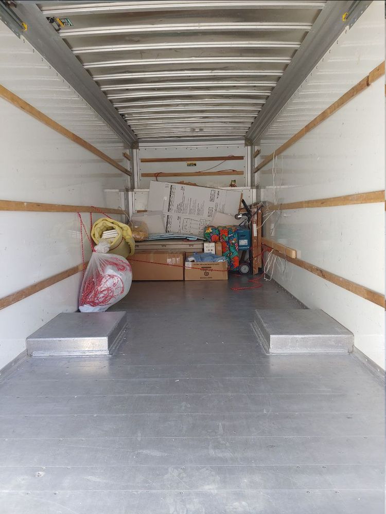 Girl_DM nui in mother's attic of the uhaul with the packing material to bring back for next trip.