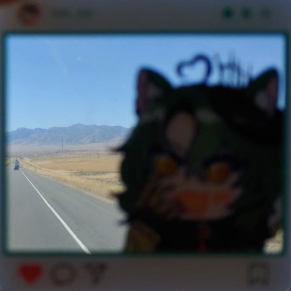 Girl_DM_ Overlay with a long mostly empty road and a mountain in the background.
