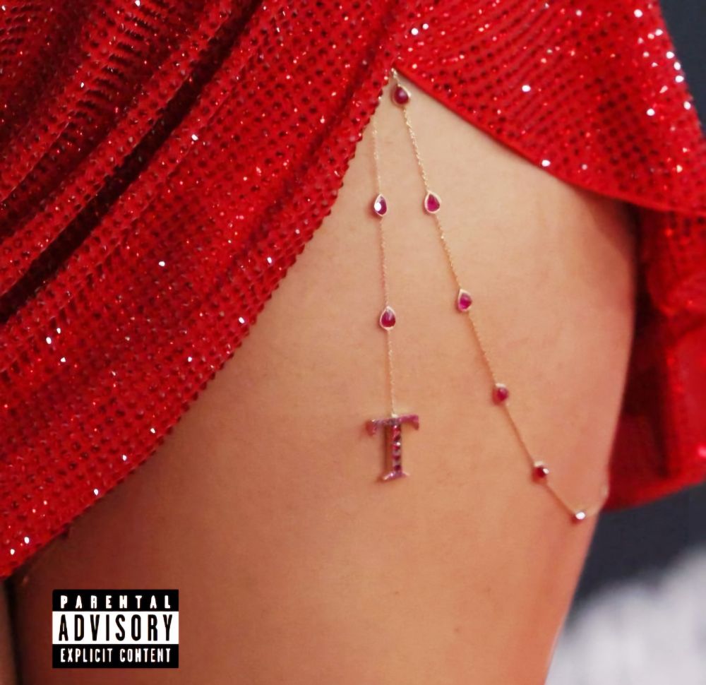 Pic of Taylor's tight chain with the parental advisory explicit content tag so it resembles an album cover