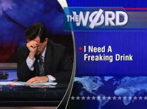 Stephen Colbert contemplating on some alcohol during a Colbert Report segment captioned "I Need a Freaking Drink."