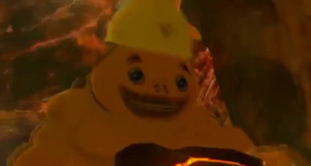 a cartoon character is wearing a yellow helmet and holding a piece of lava .