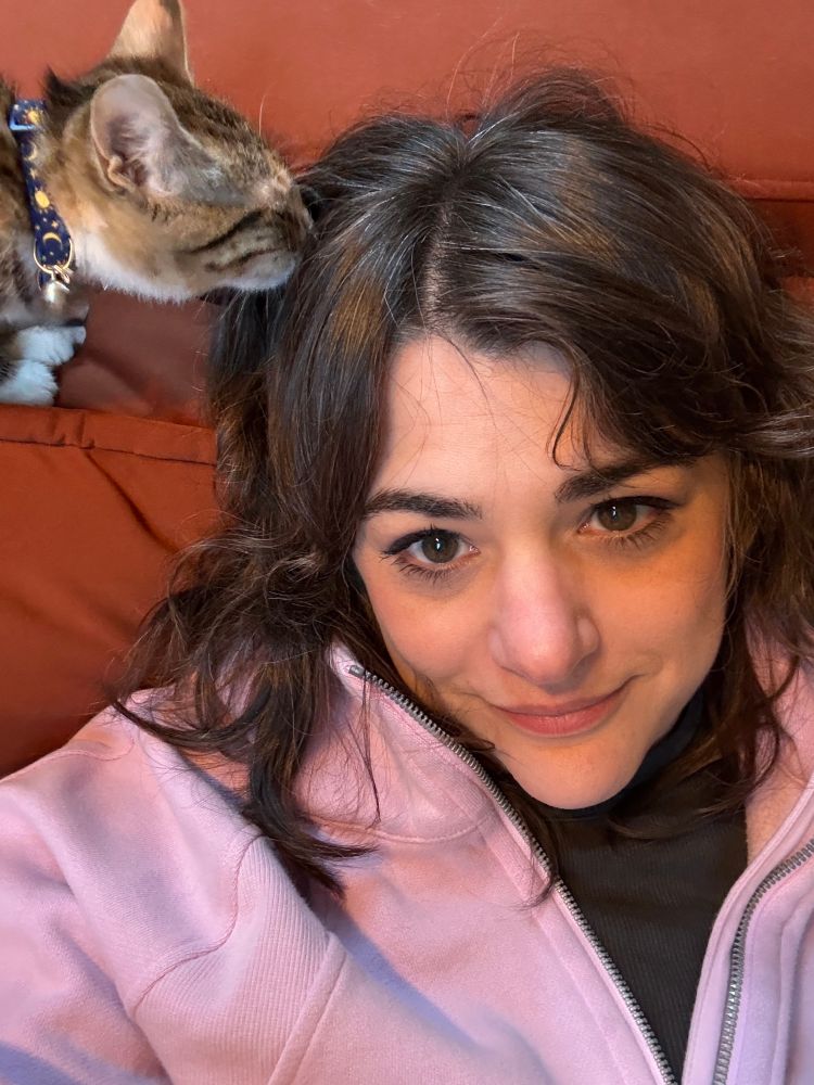 The author being groomed by her kitten 