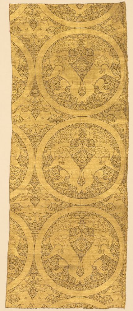 A long piece of very famous cloth of gold from said Mongol period. There are lions twisted and facing each other in roundels on an ornate background.