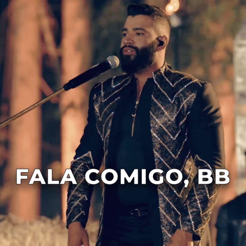 a bearded man singing into a microphone with the words fala comigo bb below him