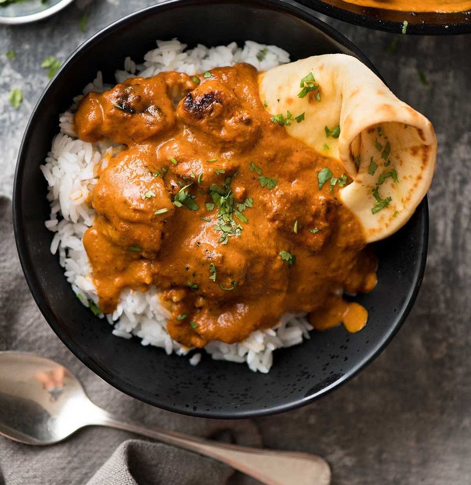 CW: FOOD. A tikka malasa curry with rice & chapati.