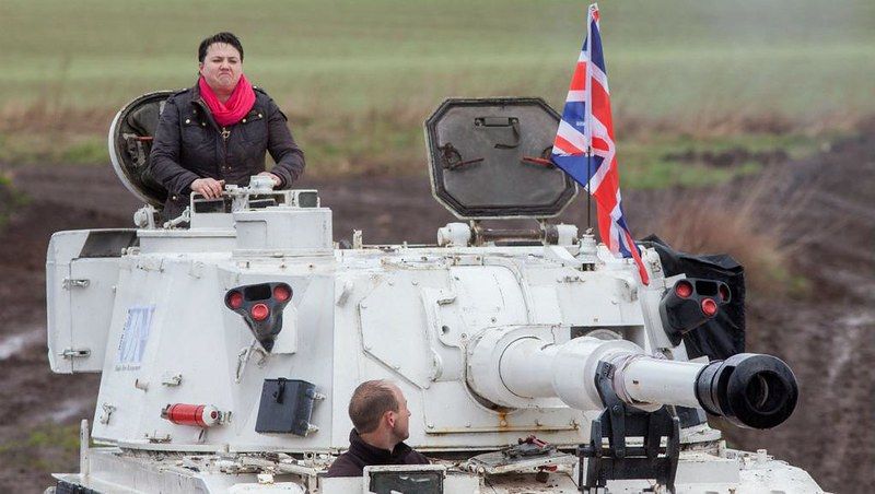 Former Scottish Conservatives branch manager Ruth Davidson, driving a massive tank with a Union Jack and pulling an odd face.