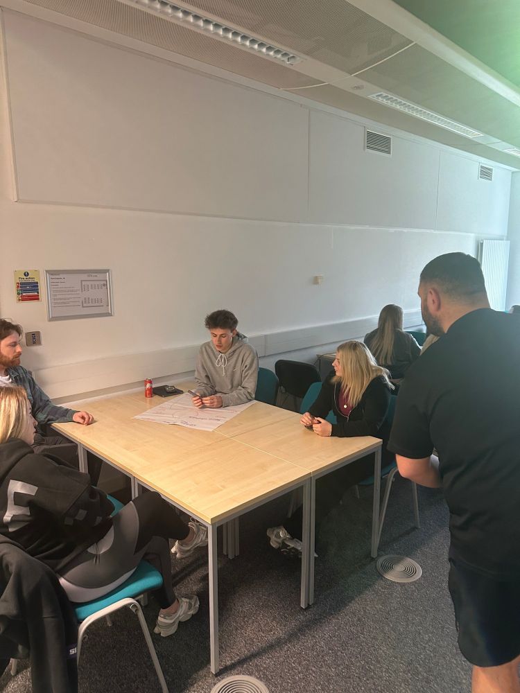 Group of people sitting at table talking