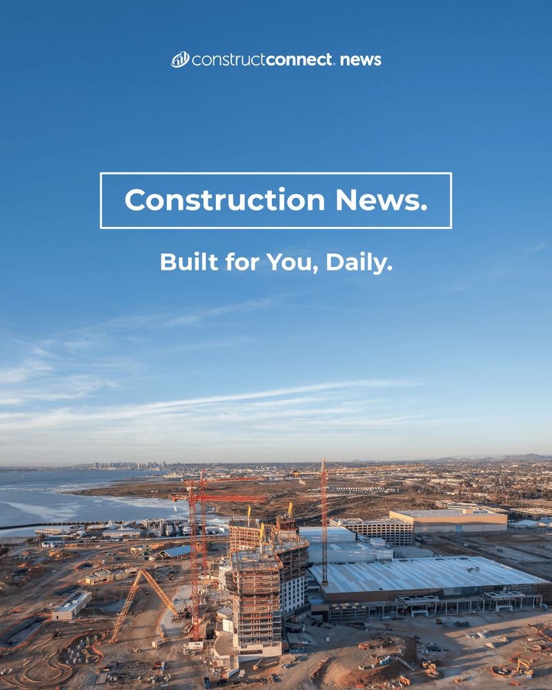 Aerial view of a large construction site featuring multiple cranes and partially built structures. A serene blue sky with light clouds forms the backdrop, while a cityscape can be seen in the distant horizon. The text overlay reads "Construction News. Built for You, Daily."