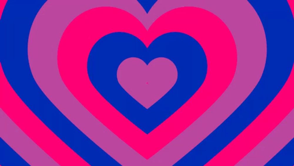 a pink and blue heart with a smaller heart in the center