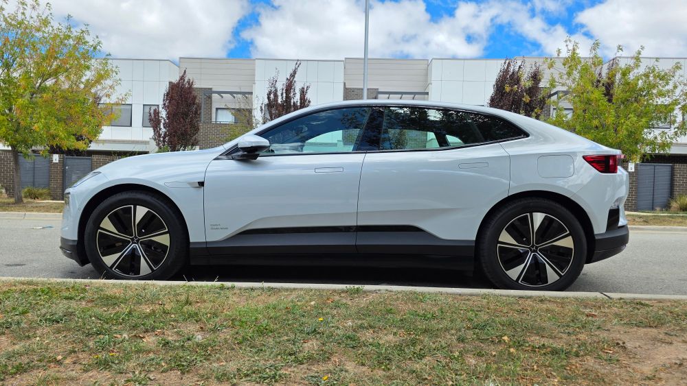 The side of the Polestar 4, a coupe SUV with a long wheelbase and a body closely resembling a large sedan.