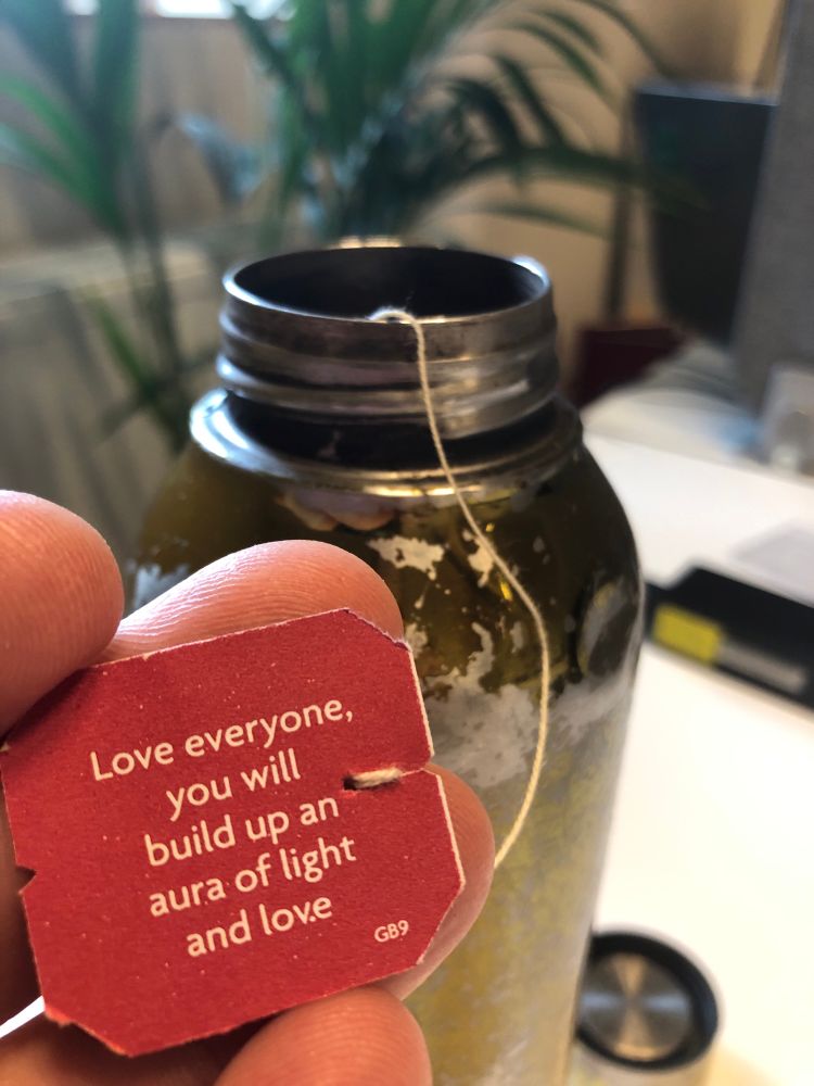 Yogi tea Label picture with a quote « love everyone. You will build up an aura of light and love »