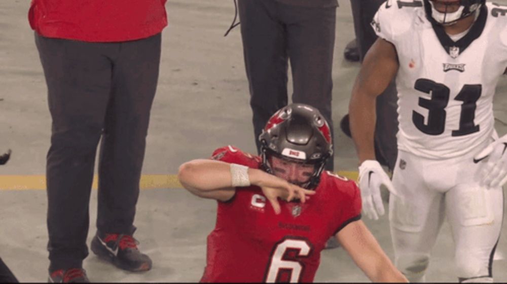 a football player in a red jersey with the number 6