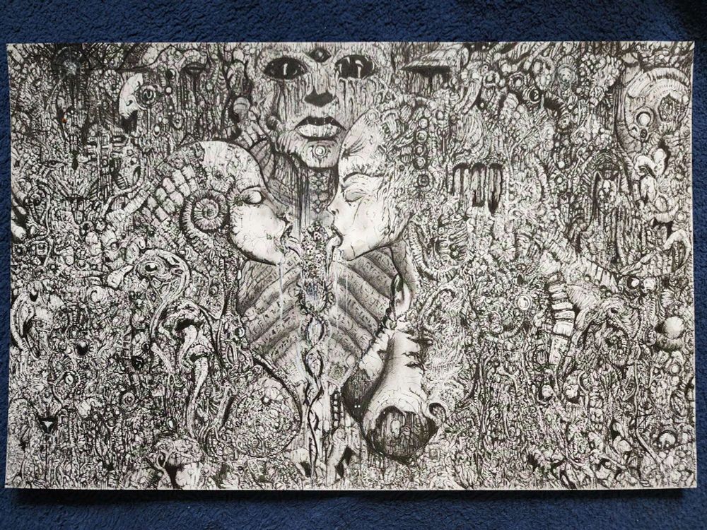Pen drawing with two feminine faces structure with long tongues licking an ice cream like structure made up of small skull like faces, each if their bodies flowing into the twisted biomechanical shapes that fill the page while a large stone like face stares out from the background
