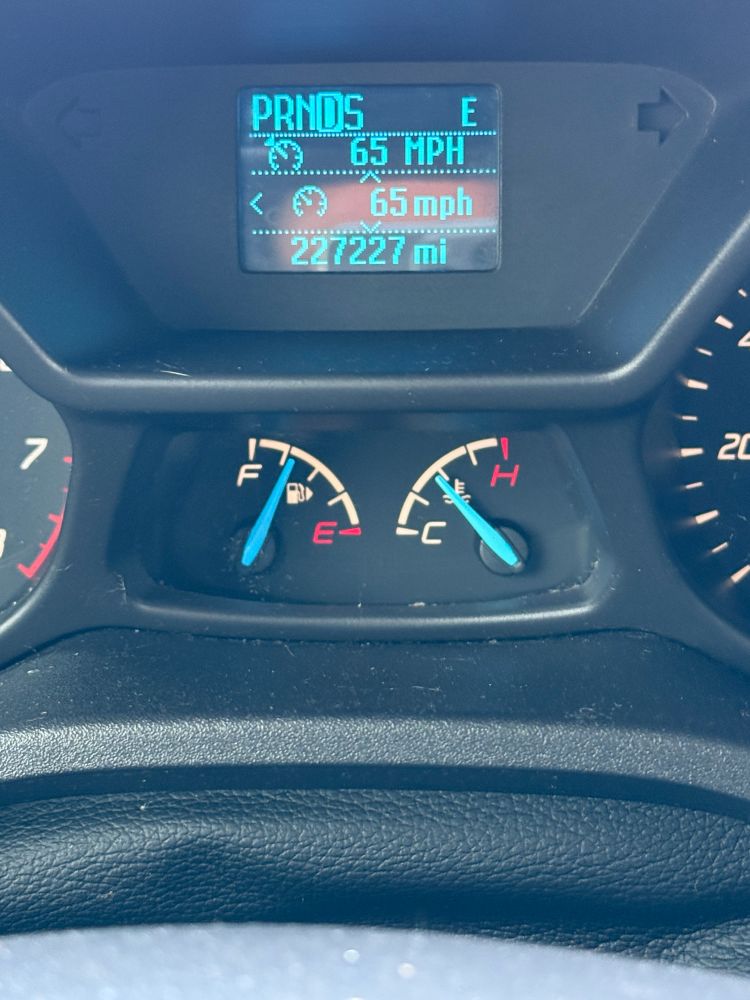 A shot of the display in my Transit Connect cargo van showing the current speed of 65 mph and the odometer reading of 227227 miles. 