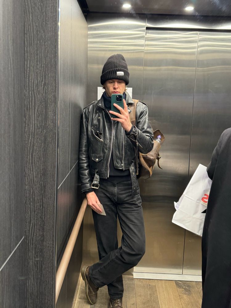 Matt elevator selfie, dressed in all black. 
black wrangler jeans, brown docs that should’ve been retired long ago, black Ganni beanie, thrifted black leather jacket.

This is a man on the verge of something big. Something big like a birthday dinner. A birthday dinner he won’t be paying for.