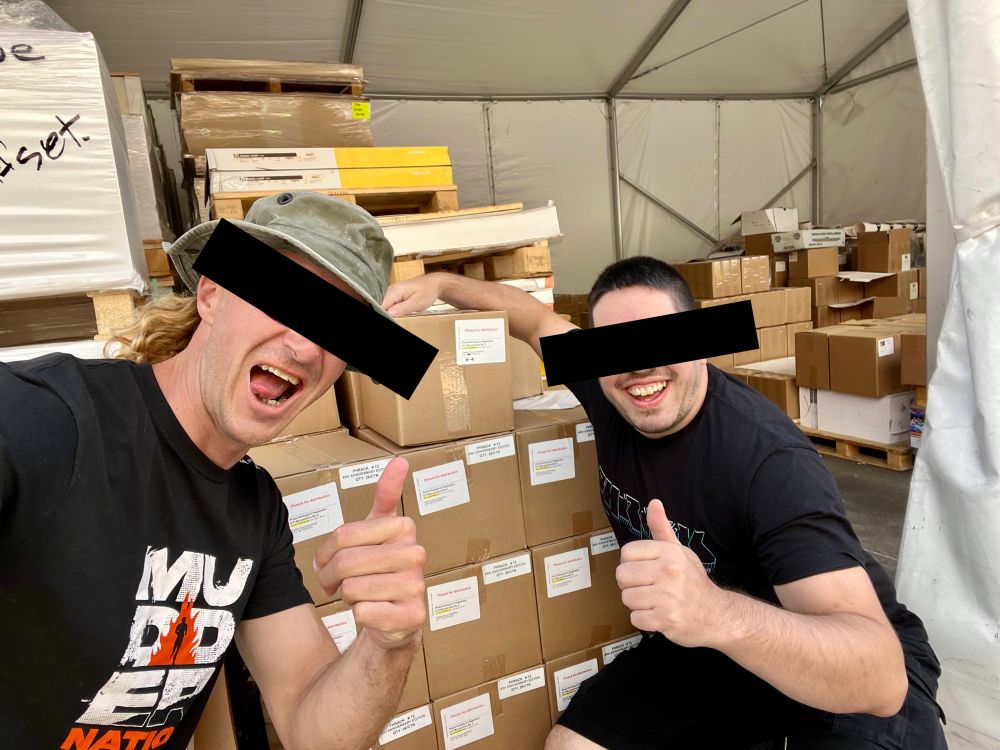 phrack staff with cases of magazines