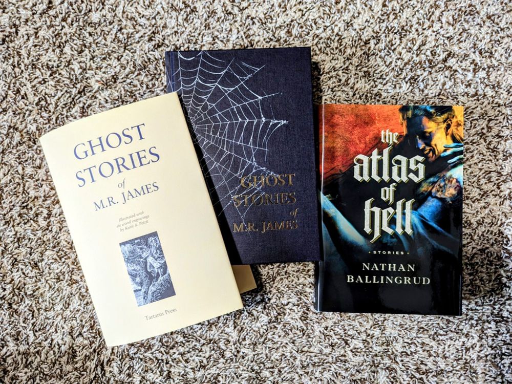 Hardcover books of GHOST STORIES OF M.R. JAMES from Tartarus Press and THE ATLAS OF HELL by Nathan Ballingrud from Midworld Press