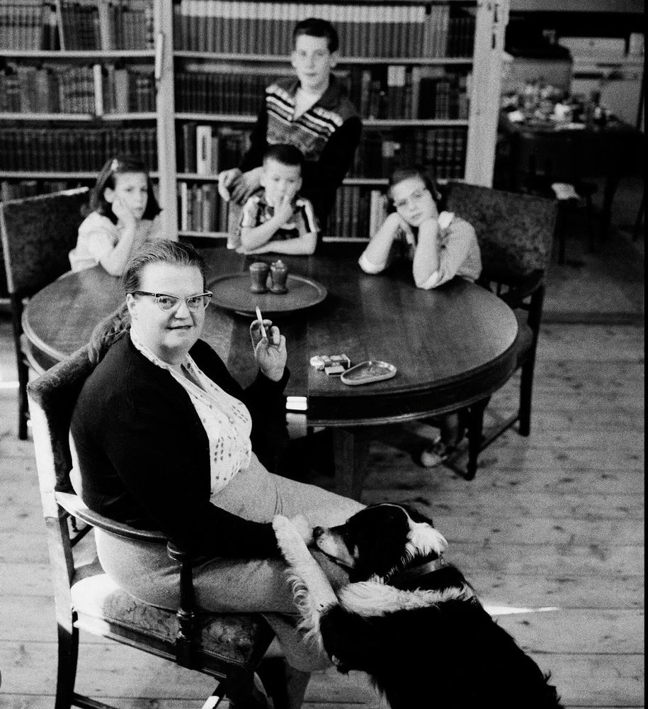 Older Shirley with her family and a dog