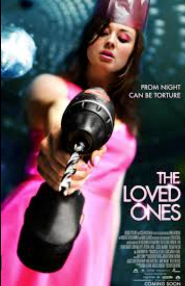 Movie poster for THE LOVED ONES. A girl in a hot pink dress wearing a paper crown is holding a drill up to the camera/viewer.