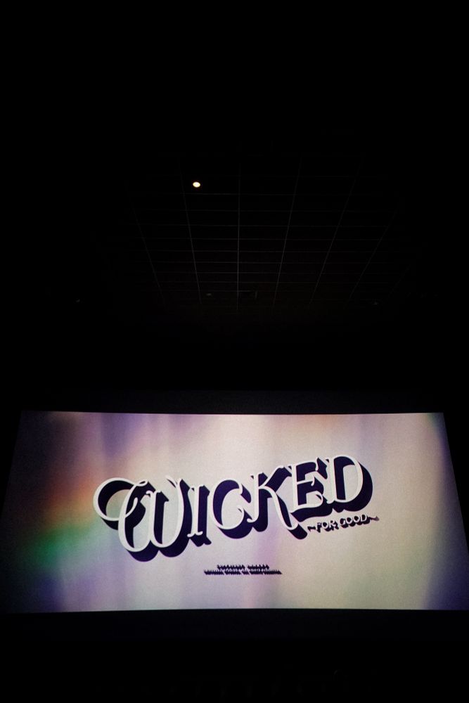 The end credits title card of Wicked For Good with a slight rainbow shimmering in the corner of the frame