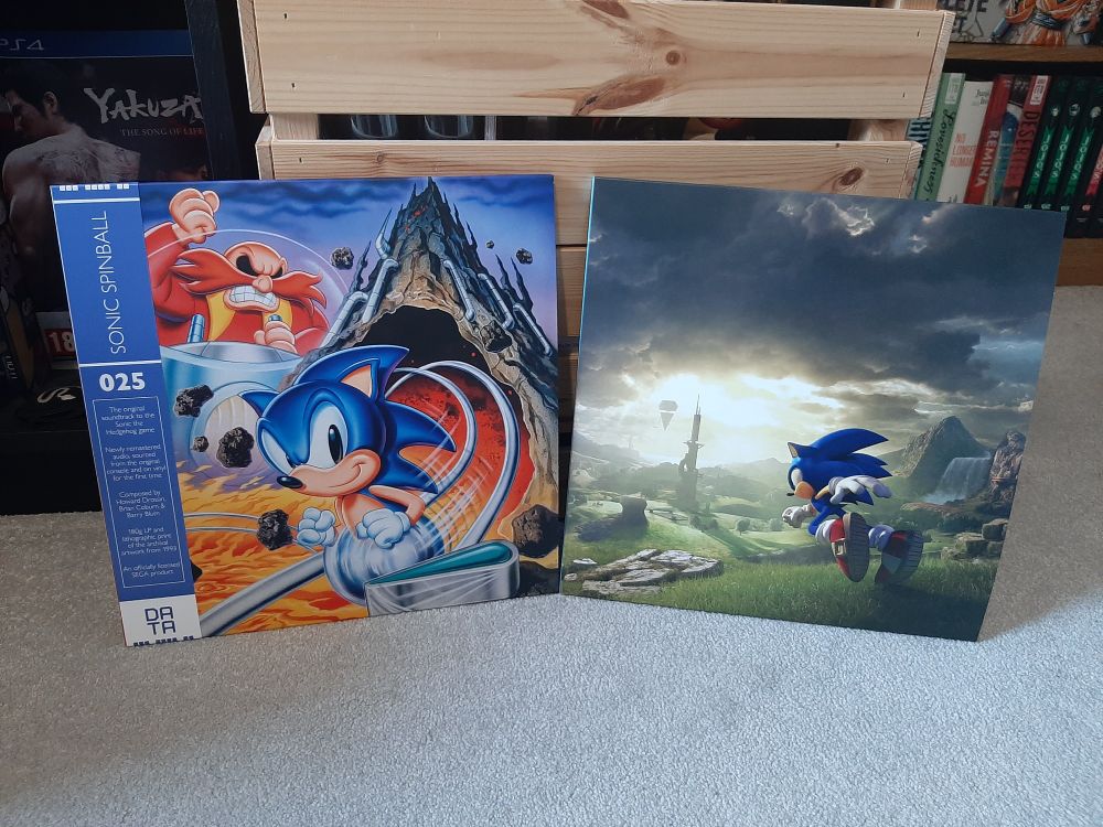 Two records laid out side by side, one of 1993s Sonic Spinball and another for Sonic Frontiers