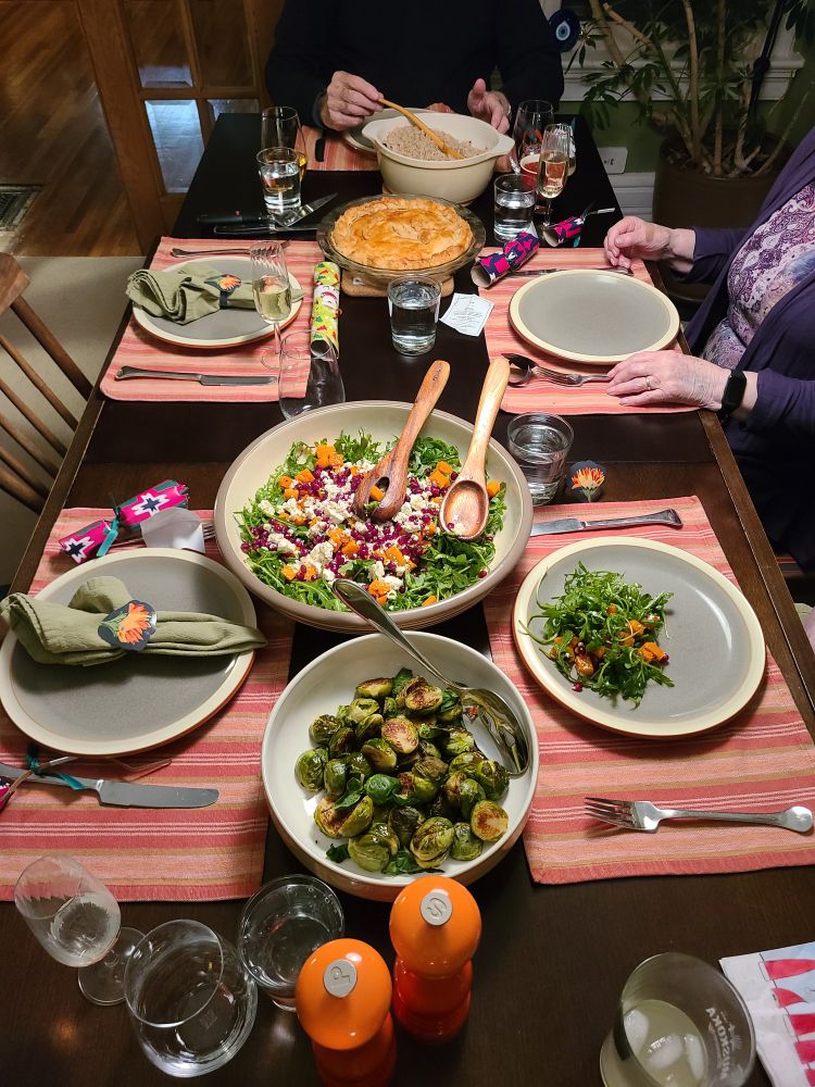 Christmas Eve dinner with tourtière, brussel sprouts, salad, and rice
