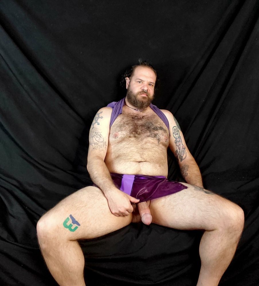 Me in a plastic purple skirt and my cock hanging out