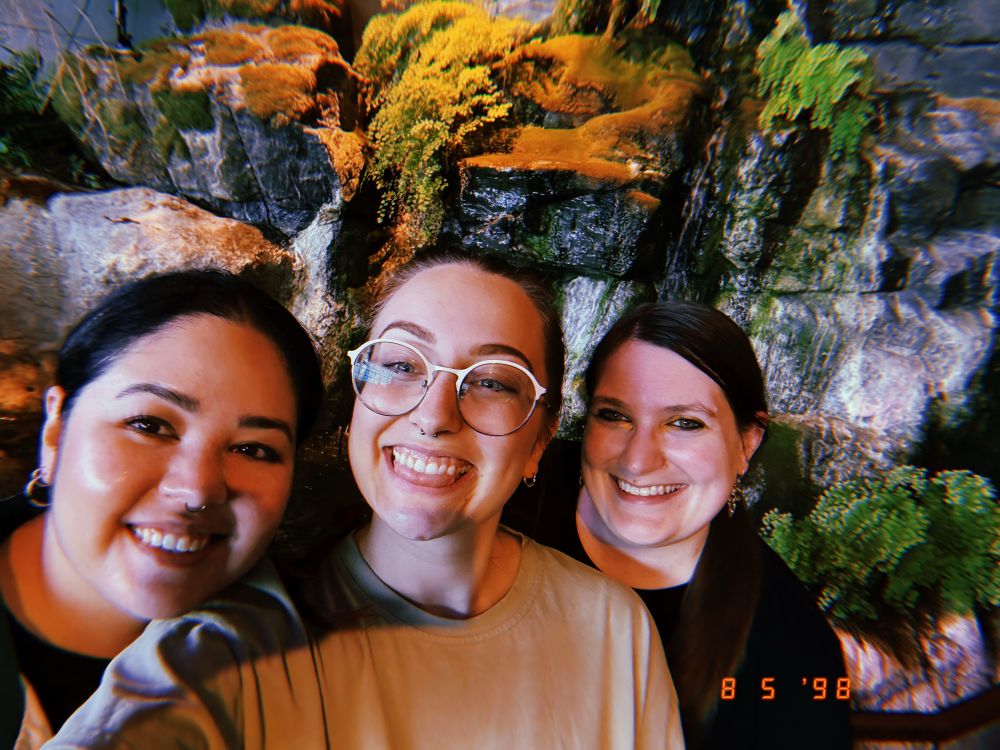 Orzul, Allie, and Chesney pose in front of an indoor waterfall! 