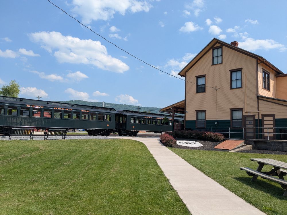 An East Broad Top passenger train sitting at Orbisonia station at the end of the day.